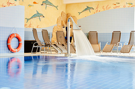 Indoor pool with waterfall shower