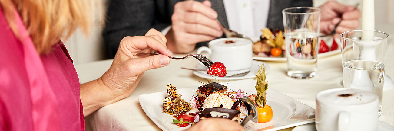 Elegant dessert with chocolate and berries served with coffee at a romantic dinner